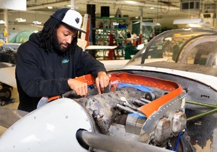 Student working on engine