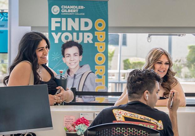 Students receiving assistance at the advising front desk