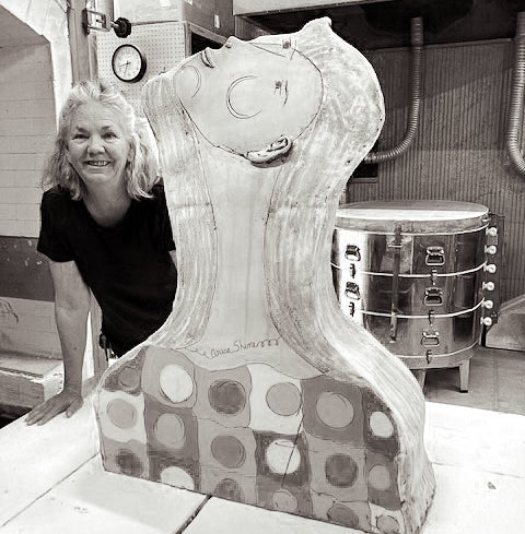 Sam Hodges poses with one of her pieces. 