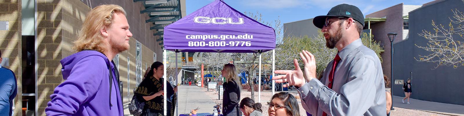 CGCC student engaging with college and transfer representatives