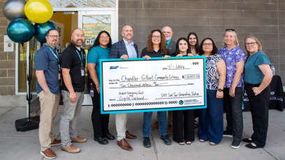 CGCC and SRP leadership pose with $10,000 check outside the Coyote Cupboard at CGCC's Pecos campus