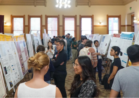 Attendees look at posters at ASU’s School of Molecular Sciences’ Inaugural Spring Research Poster Symposium
