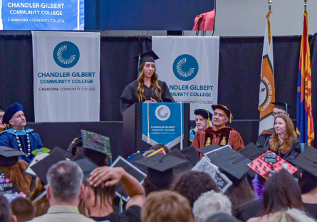 Madison Shumway speaks at the podium at the 2026 CGCC Commencement Ceremony