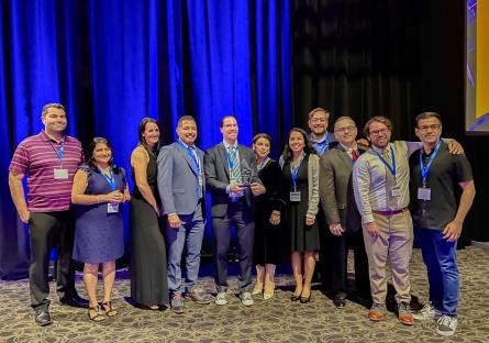 The group from Intel, CGCC, EMCC, and MCCCD accept the 2022 Governor’s Celebration of Innovation award for Innovator of the Year for Academia. 