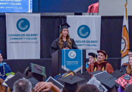 Madison Shumway speaks at the podium at the 2026 CGCC Commencement Ceremony
