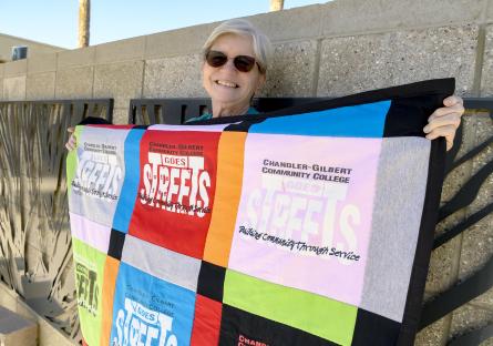 Teresa Hull and her quilt