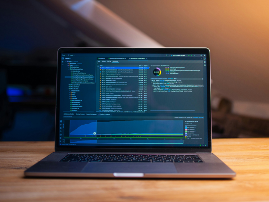 Laptop displaying Python code on the screen, used for programming and data analysis.